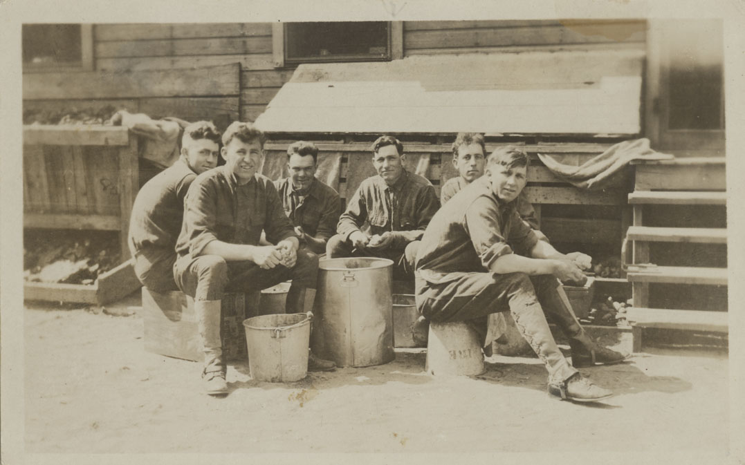 Six men peeling potatoes. Camp Lewis, Washington.