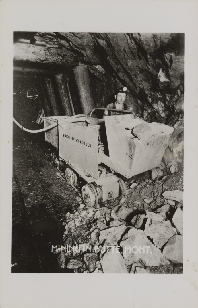 Mining in Butte, Montana. Loading underground.