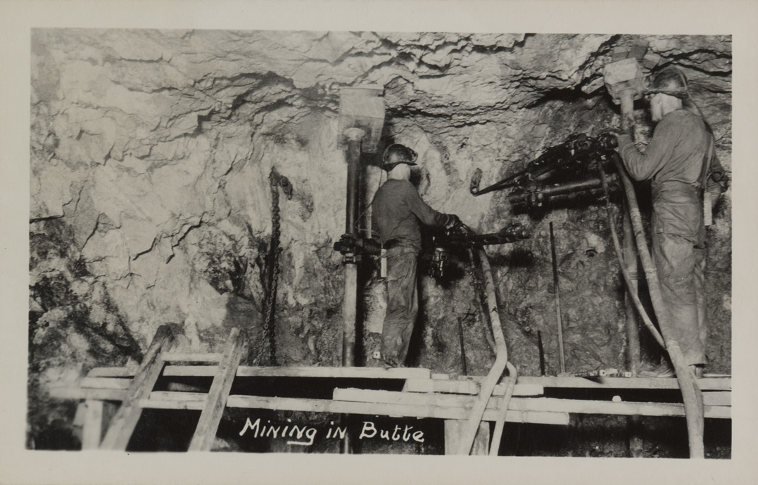 Mining in Butte, Montana. Miners drilling underground.